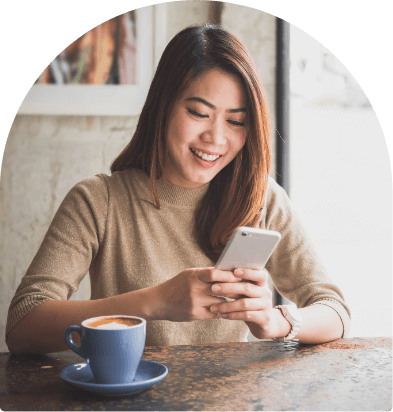 woman with phone and coffee